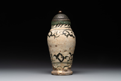 An early Islamic pottery albarello with engraved copper mount and cover, probably Nishapur, Iran, 10/11th C.