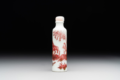 A Chinese copper-red snuff bottle with travellers in a landscape, Qianlong mark, 19th C.