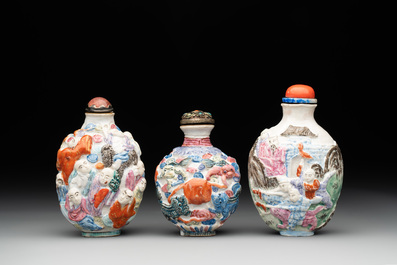 Six Chinese moulded famille rose snuff bottles, Qianlong mark, 19th C.