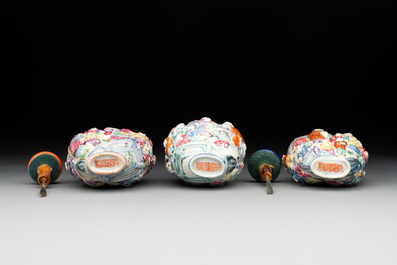 Six Chinese moulded famille rose snuff bottles, Qianlong mark, 19th C.