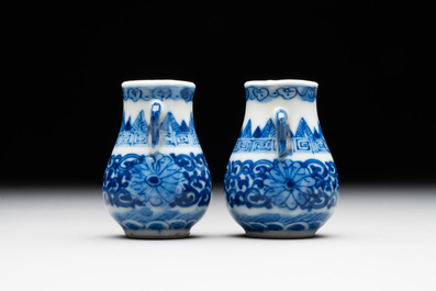 A pair of Chinese blue and white miniature 'hu' vases on wooden stands, Kangxi mark, 19th C.