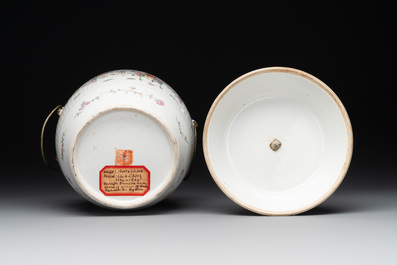 A pair of Chinese famille rose jars and covers with figures in a garden, Tongzhi mark and of the period