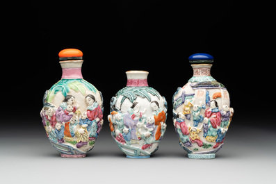 Six Chinese moulded famille rose snuff bottles, Qianlong mark, 19th C.