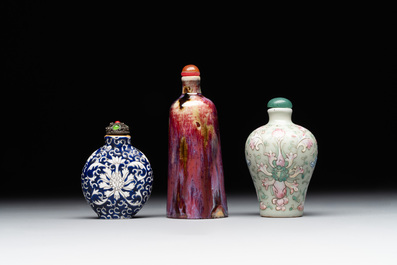 Two Chinese famille rose 'lotus scroll' snuff bottles and a flamb&eacute;-glazed snuff bottle, 19th C.
