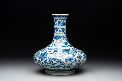 A Chinese blue and white 'lotus scroll' bottle vase, 18/19th C.
