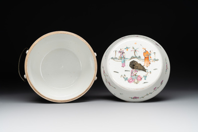 A pair of Chinese famille rose jars and covers with figures in a garden, Tongzhi mark and of the period
