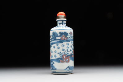 A Chinese blue, white and copper-red snuff bottle, Kangxi mark, 19th C.