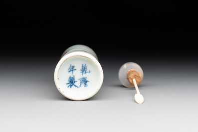A Chinese copper-red snuff bottle with travellers in a landscape, Qianlong mark, 19th C.
