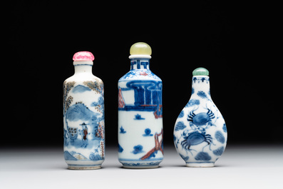 Two Chinese blue, white and copper-red snuff bottles and a blue and white 'crab' snuff bottle, Chenghua and Qianlong mark, 19th C.
