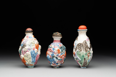 Six Chinese moulded famille rose snuff bottles, Qianlong mark, 19th C.