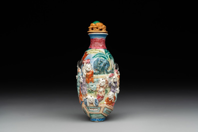 A Chinese famille rose moulded snuff bottle, Qianlong mark, late 18th/early 19th C.