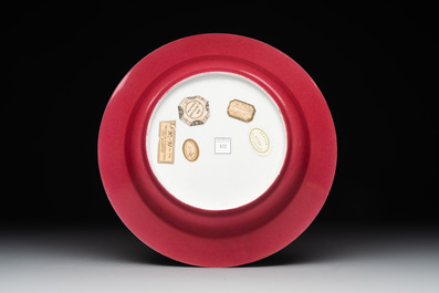 A fine Chinese famille rose 'ruby back' plate with a bird on a blossoming branch, Yongzheng