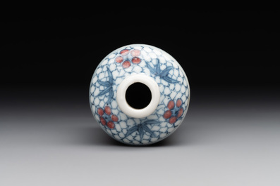 A Chinese blue, white and copper-red snuff bottle, Yongzheng mark, 19th C.
