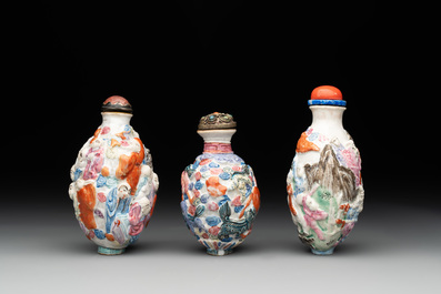 Six Chinese moulded famille rose snuff bottles, Qianlong mark, 19th C.