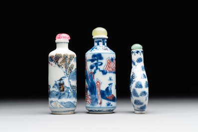 Two Chinese blue, white and copper-red snuff bottles and a blue and white 'crab' snuff bottle, Chenghua and Qianlong mark, 19th C.