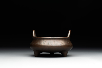 A Chinese bronze tripod censer, Guan Huai Tang Zhu Ren 冠槐堂主人 mark, 17/18th C.