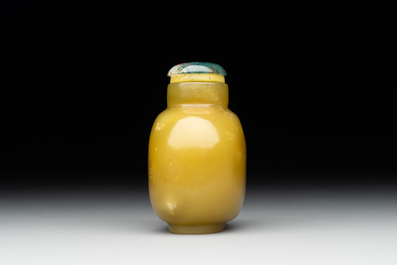 A Chinese yellow jade snuff bottle with moss agate cover and bone stopper, 19th C.