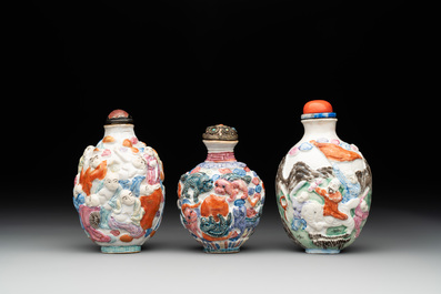Six Chinese moulded famille rose snuff bottles, Qianlong mark, 19th C.
