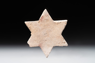 An Kashan lustre-glazed star tile and a rectangular moulded ornamental tile, Persia, 13/14th C.