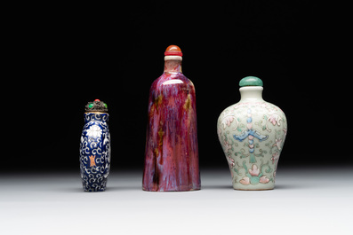 Two Chinese famille rose 'lotus scroll' snuff bottles and a flamb&eacute;-glazed snuff bottle, 19th C.