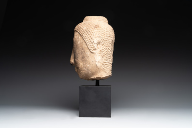 A Thai sandstone head of Buddha, possibly Ayutthaya period, 14/15th C.