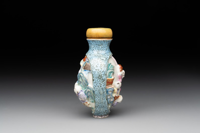 A Chinese moulded famille rose 'playing boys' snuff bottle, Qianlong mark, 19th C.
