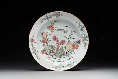 A Chinese famille rose dish, two plates and a Dutch-decorated plate, Qianlong