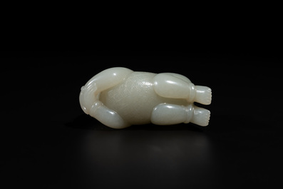 A Chinese white jade carving of a reclining boy, Qing