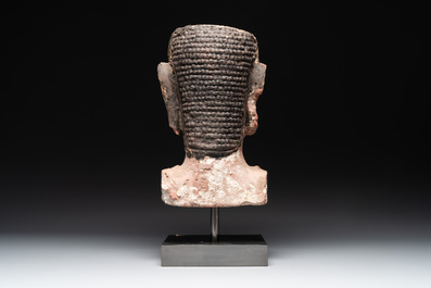 A Thai red sandstone head of Buddha, possibly Ayutthaya period, 15th C.