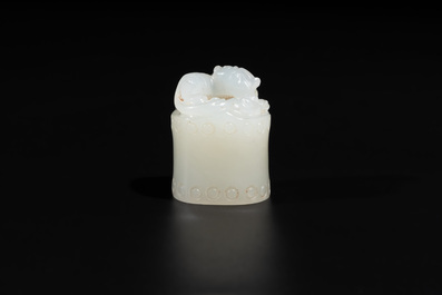 A Chinese white jade carving of a chilong reclining on bamboo, Qing