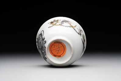 A Chinese gilt-decorated grisaille armorial cup and saucer, Qianlong