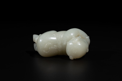 A Chinese white jade carving of a reclining boy, Qing