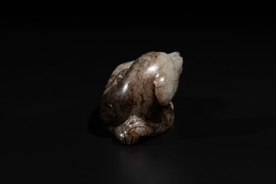 A Chinese partly black coloured white jade dog carving, Qing