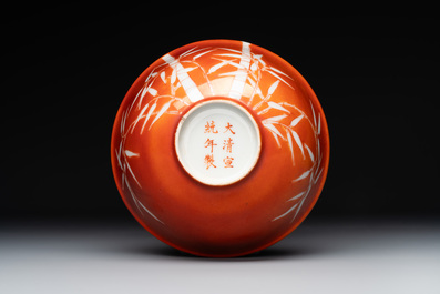A Chinese coral-red-glazed bowl with reverse-decorated bamboo design, Xuantong mark and of the period