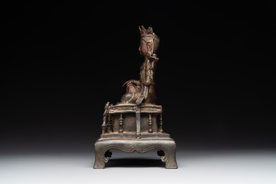A Chinese bronze Bodhisattva on stand, Yongle mark, dated 1422