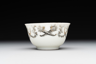 A Chinese gilt-decorated grisaille armorial cup and saucer, Qianlong