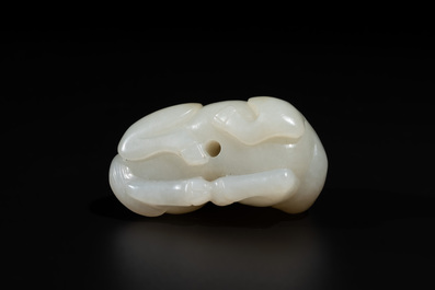 A Chinese white jade carving of a reclining camel, Qing