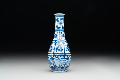 A Chinese blue and white facetted bottle vase with floral design, Kangxi
