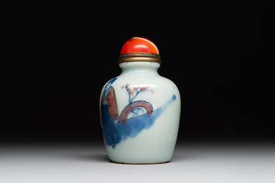 A Chinese blue, white and copper-red snuff bottle, 19th C.