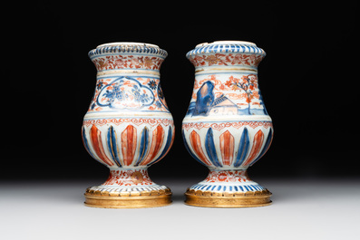 A pair of Chinese Imari-style casters or vases with gilt bronze mounts, Kangxi