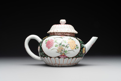 A Chinese famille rose black-ground teapot with cover and stand and a sauce boat, Qianlong