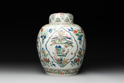 A Chinese famille verte 'figures and antiquities' jar and cover, Kangxi