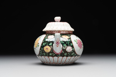 A Chinese famille rose black-ground teapot with cover and stand and a sauce boat, Qianlong