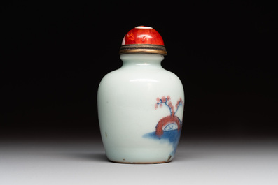 A Chinese blue, white and copper-red snuff bottle, 19th C.