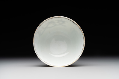 A Chinese gilt-decorated grisaille armorial cup and saucer, Qianlong