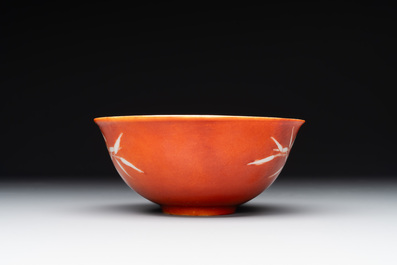 A Chinese coral-red-glazed bowl with reverse-decorated bamboo design, Xuantong mark and of the period