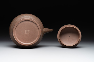A Chinese polished purple Yixing stoneware covered teapot for the Thai market and a blue and white covered teapot, 19th C.