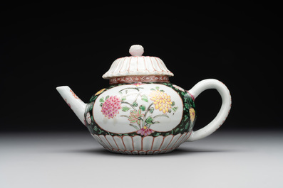 A Chinese famille rose black-ground teapot with cover and stand and a sauce boat, Qianlong