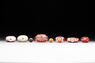 A group of six Chinese overlay glass snuff bottles, 19th C.