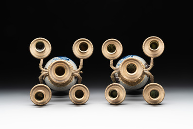 A pair of Chinese blue and white Nanking crackle-glazed vases with gilt bronze candelabra mounts, 19th C.